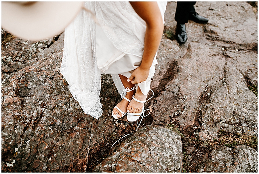 bride taking off shoes