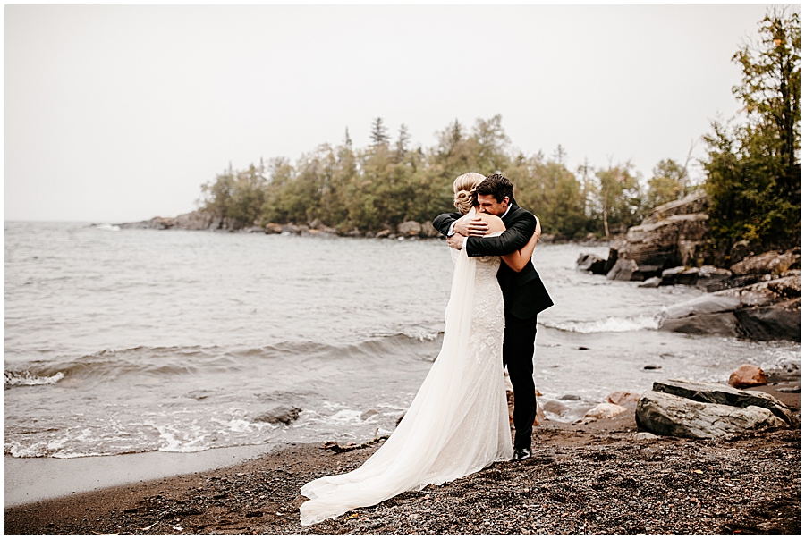 bride and groom hugging on minnesota north shore